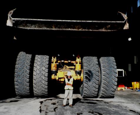 A man conducting an audit of a coal mining operation.