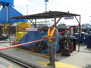 A man conducting a workplace inspection and environmental assessment.