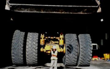 A man conducting an audit of a coal mining operation.